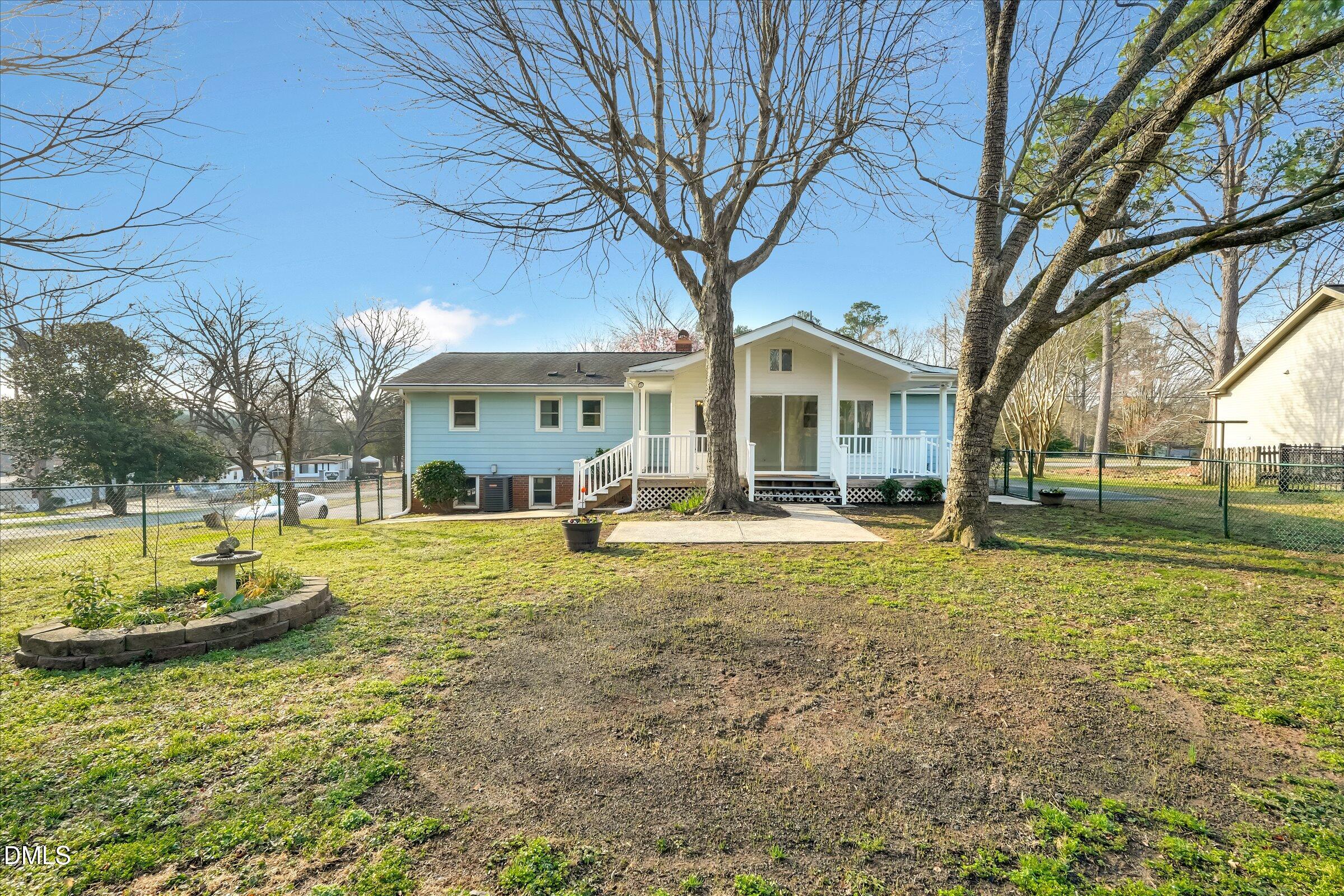 4108 Campbell Road Raleigh, NC 27606 - Photo 26 of 42 a view of a house with swimming pool and sitting area