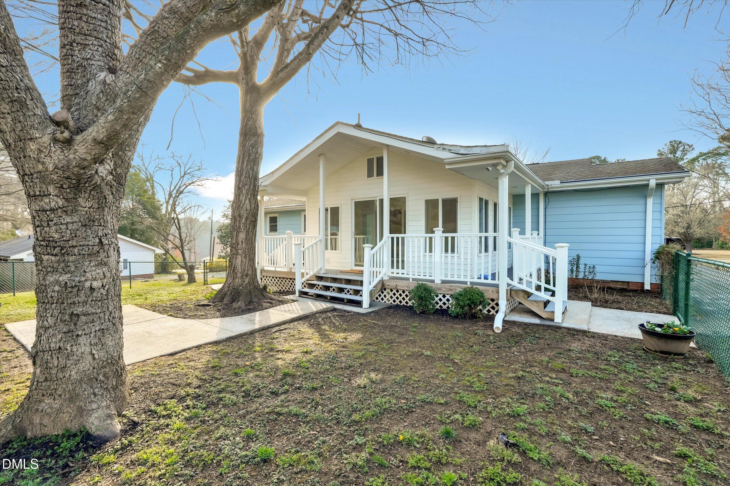 4108 Campbell Road Raleigh, NC 27606 - Photo 27 of 42 a view of a house with a yard and sitting area