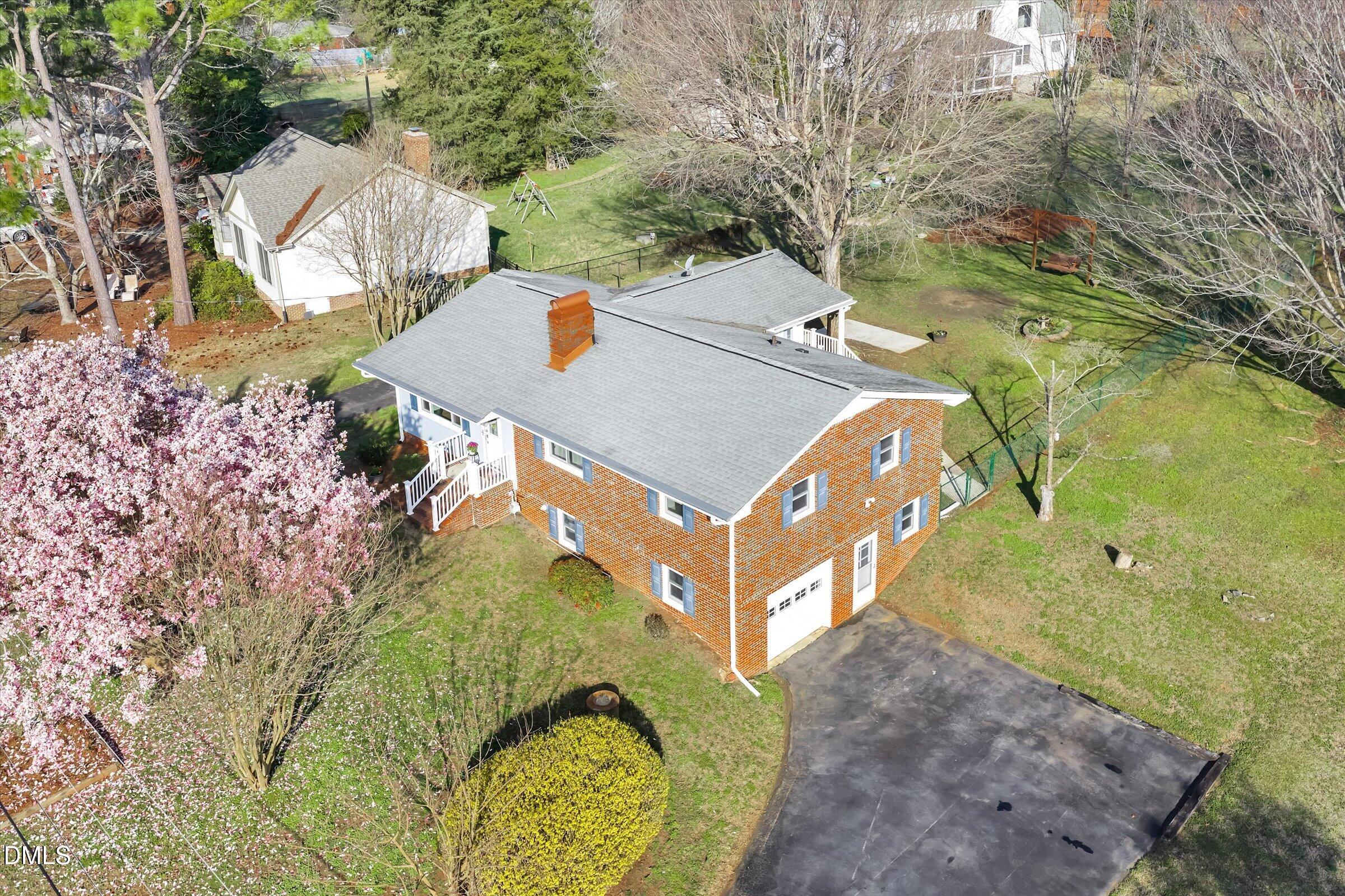 4108 Campbell Road Raleigh, NC 27606 - Photo 33 of 42 an aerial view of a house with a yard swimming pool and outdoor seating