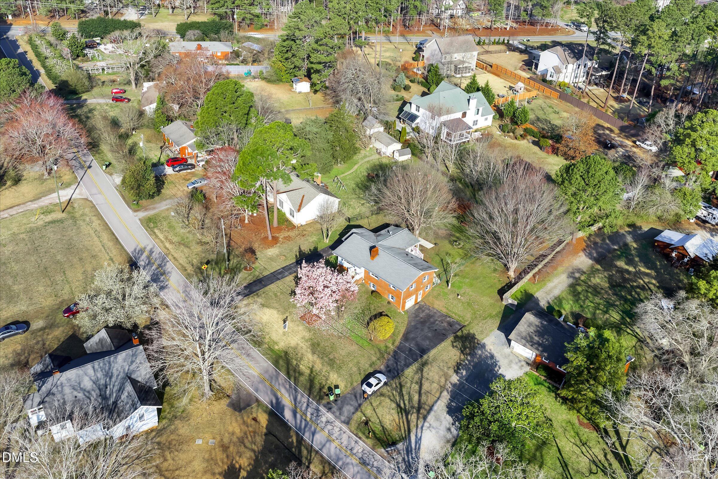 4108 Campbell Road Raleigh, NC 27606 - Photo 35 of 42 an aerial view of a house with a yard and large trees