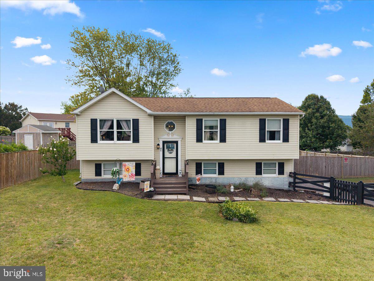 Charming split-level home with yard.