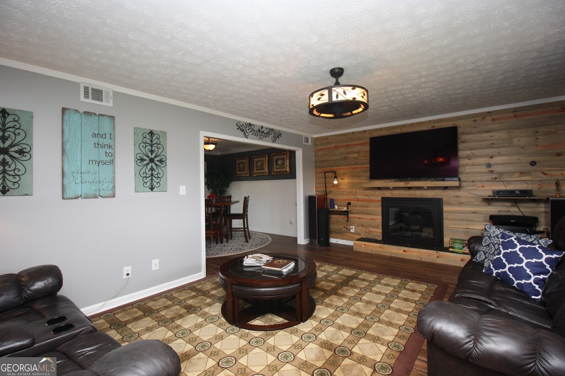 231 Murphy Road LaGrange, GA 30240 - Photo 2 of 24 a living room with furniture a flat screen tv and a fireplace