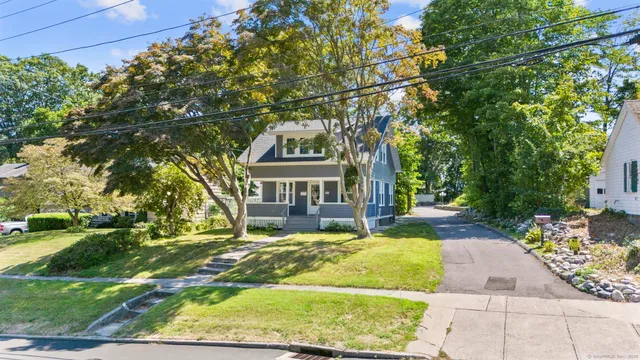 a view of house with yard