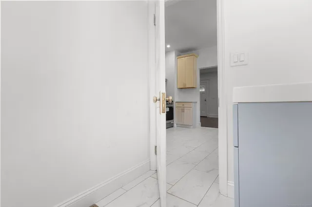 a view of a bathroom from a hallway