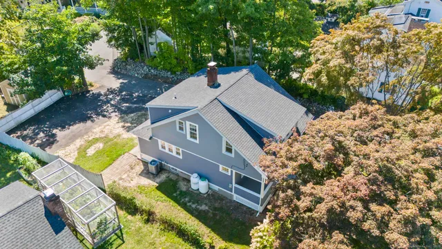 an aerial view of house with yard