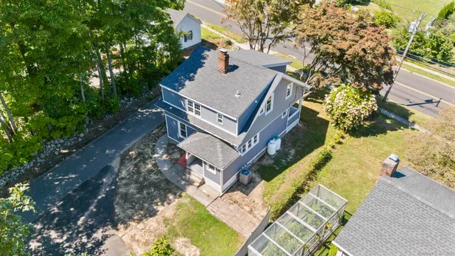 a view of a house with a yard