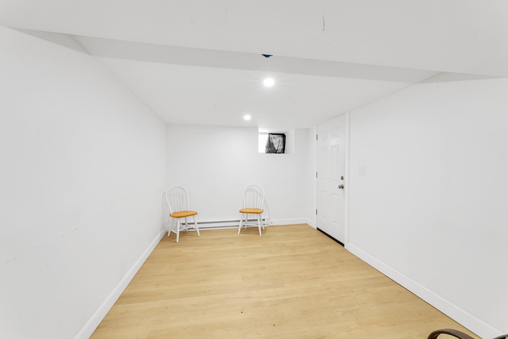 36 Brookledge Street Boston, MA 02121 - Photo 28 of 31 a room with a table and a chair
