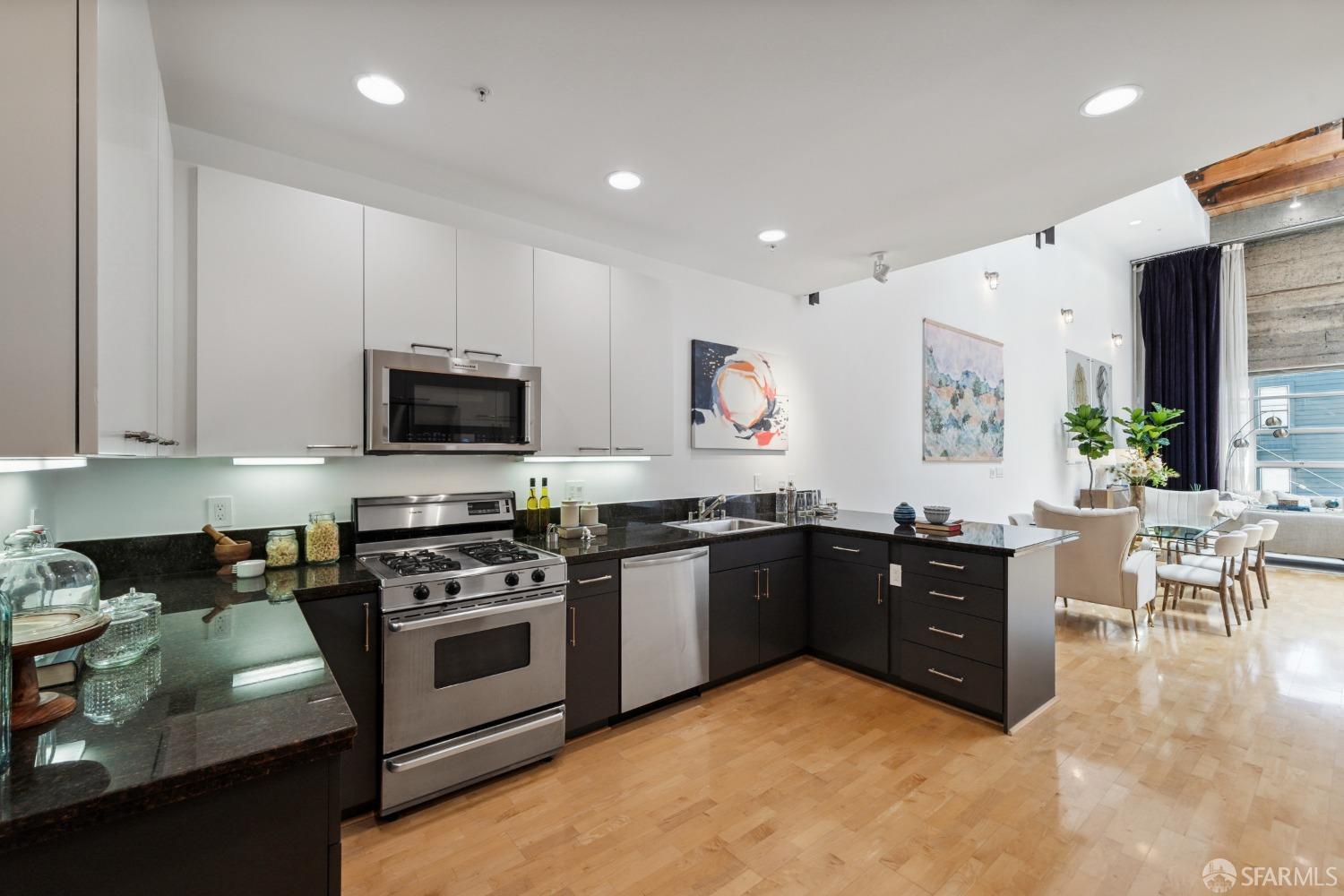 1 Rausch Street, Unit G San Francisco, CA 94103 - Photo 13 of 49 a kitchen with stainless steel appliances a stove a sink a microwave a refrigerator and cabinets