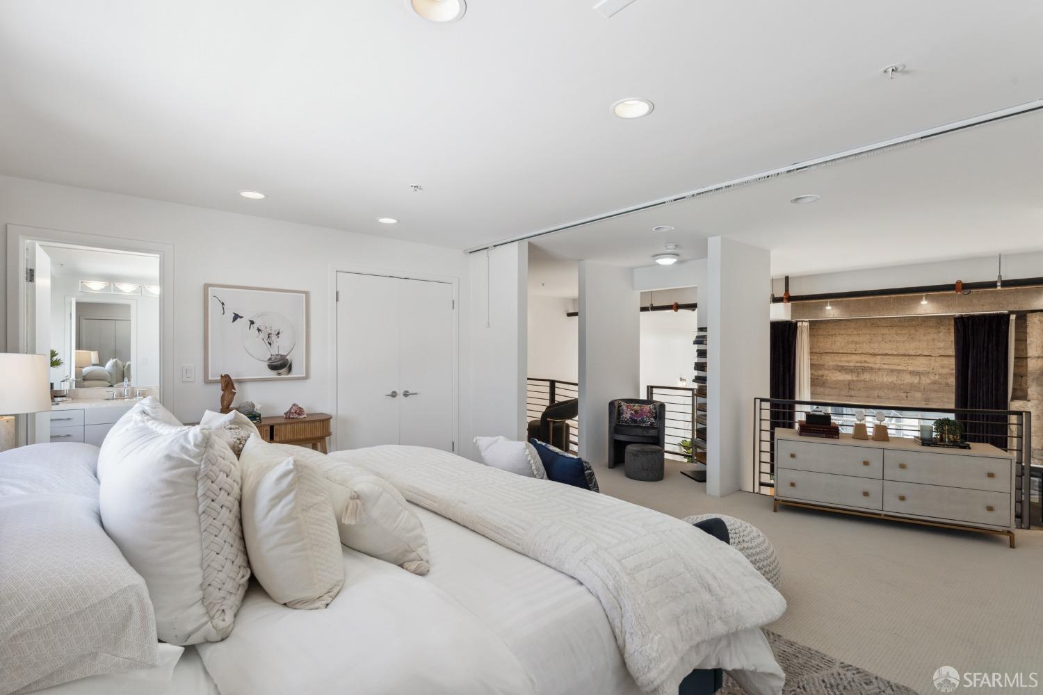 1 Rausch Street, Unit G San Francisco, CA 94103 - Photo 32 of 49 a bedroom with furniture and a flat screen tv