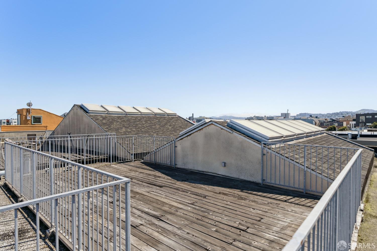 1 Rausch Street, Unit G San Francisco, CA 94103 - Photo 42 of 49 a view of a roof deck with wooden floor and fence