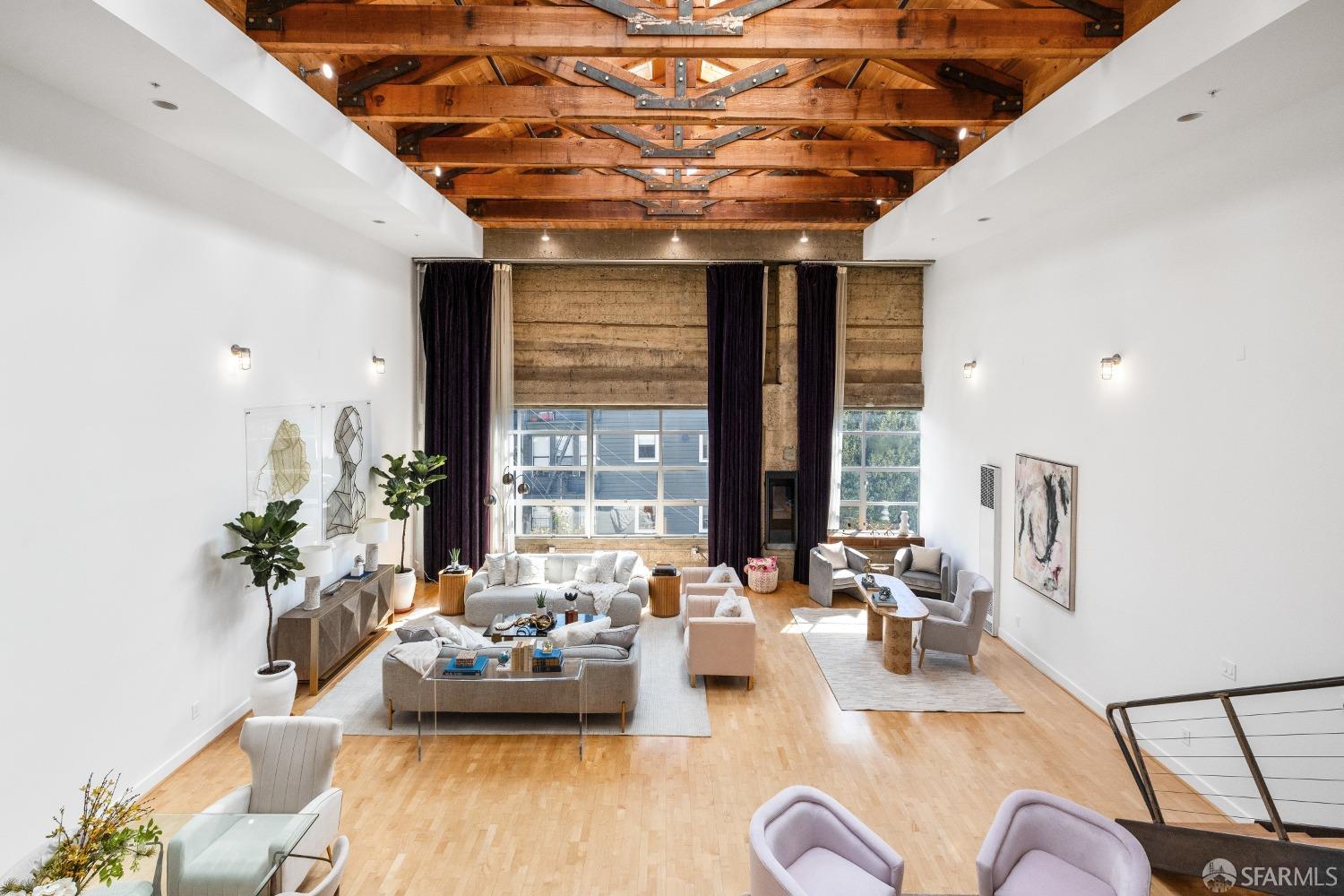 1 Rausch Street, Unit G San Francisco, CA 94103 - Photo 9 of 49 a living room with furniture and a large window