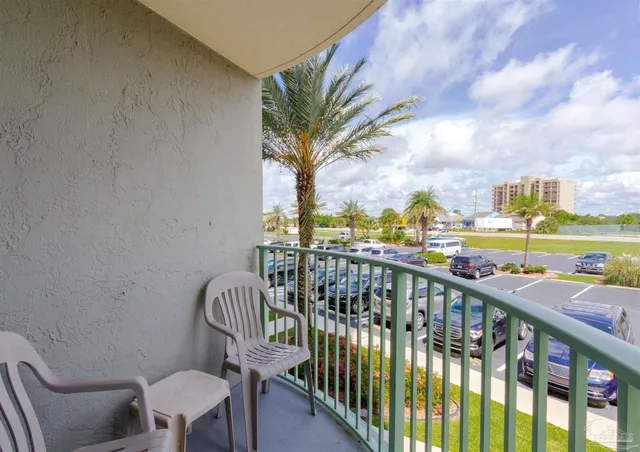 a view of a balcony with furniture