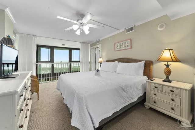 a bedroom with a large bed and a window