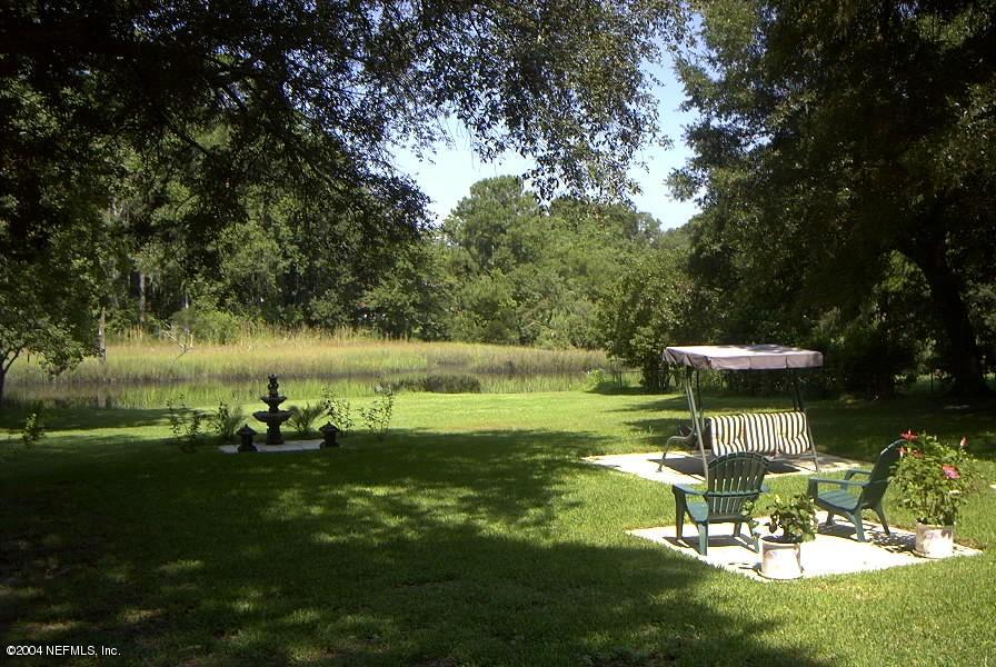 10540 Tulsa Road Jacksonville, FL 32218 - Photo 2 of 3 a view of a park with large trees