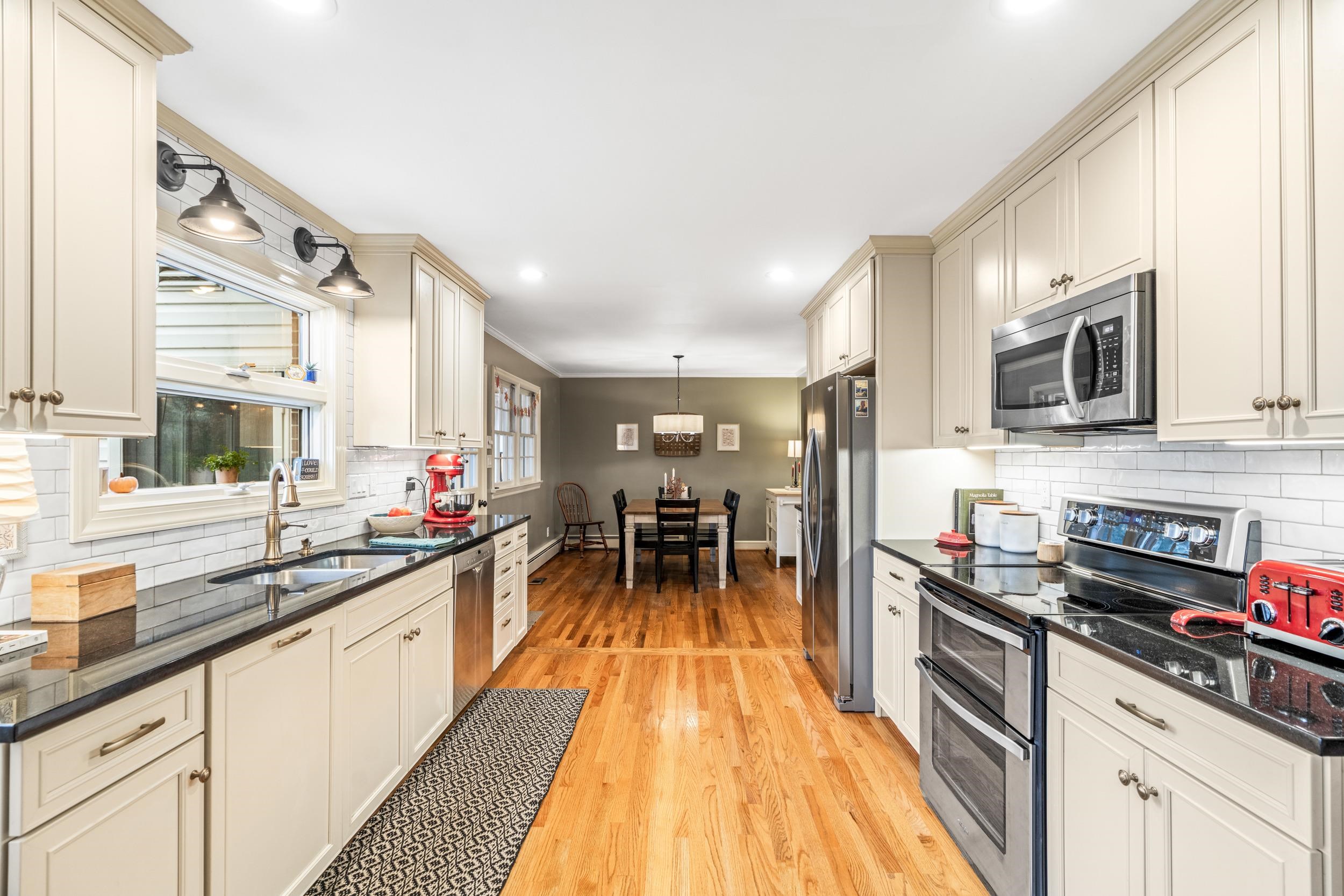 1220 Chatham Road Waynesboro, VA 22980 - Photo 13 of 64 a kitchen with stainless steel appliances a sink stove and cabinets