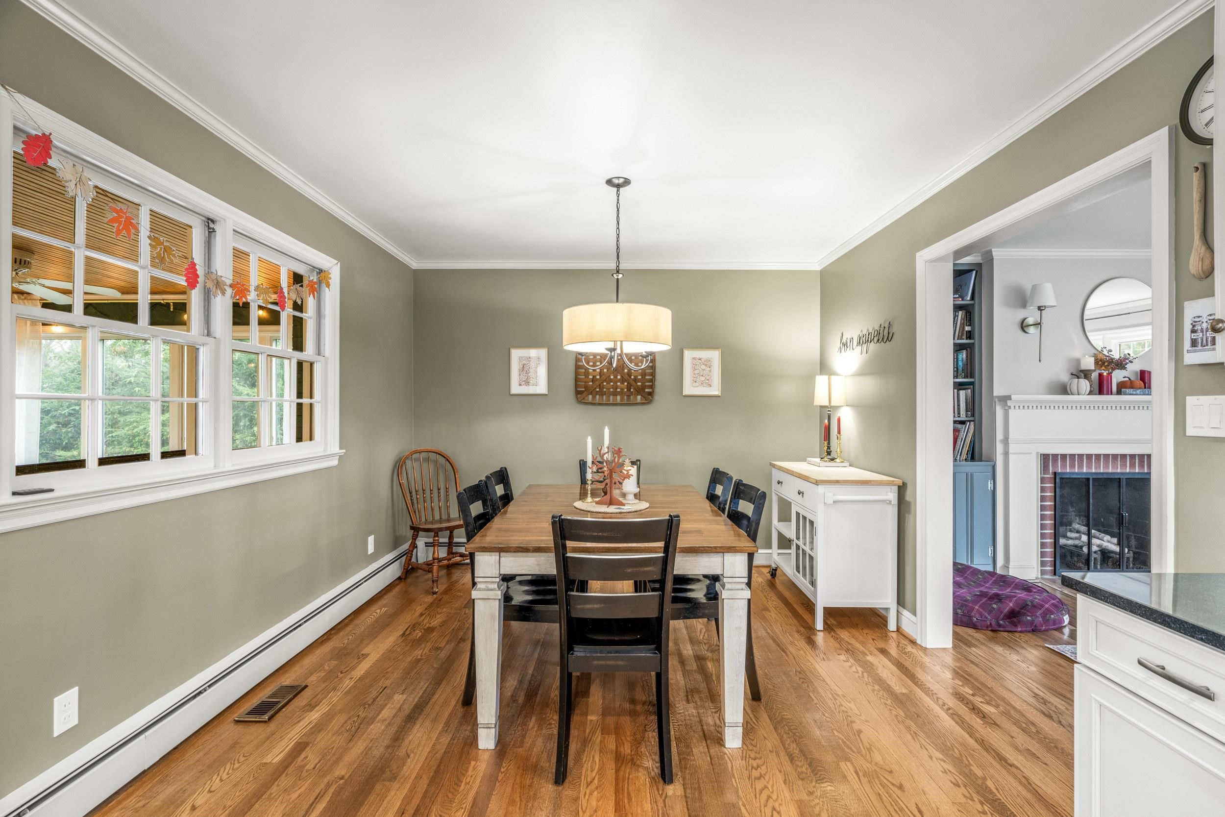 1220 Chatham Road Waynesboro, VA 22980 - Photo 20 of 64 a dining room with furniture a fireplace and wooden floor