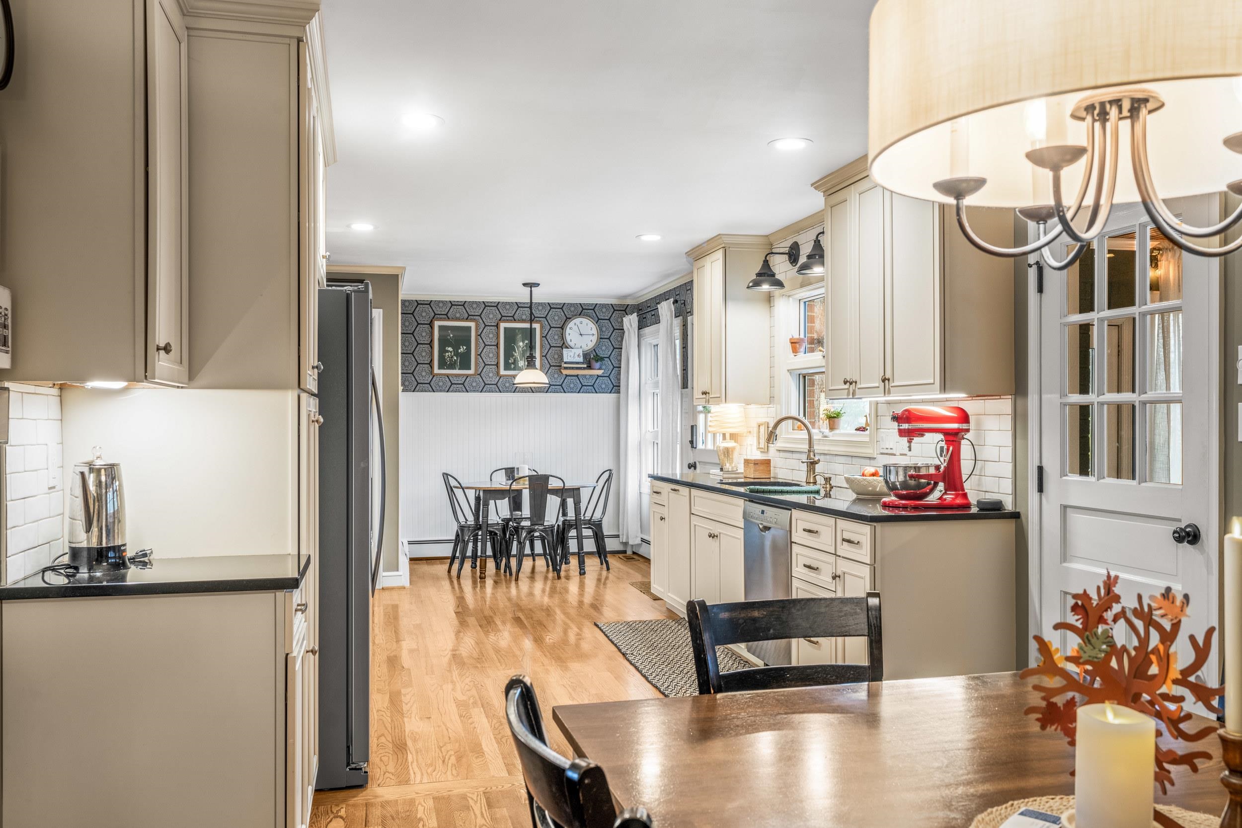 1220 Chatham Road Waynesboro, VA 22980 - Photo 22 of 64 a living room with stainless steel appliances kitchen island granite countertop furniture and a dining table with wooden floor