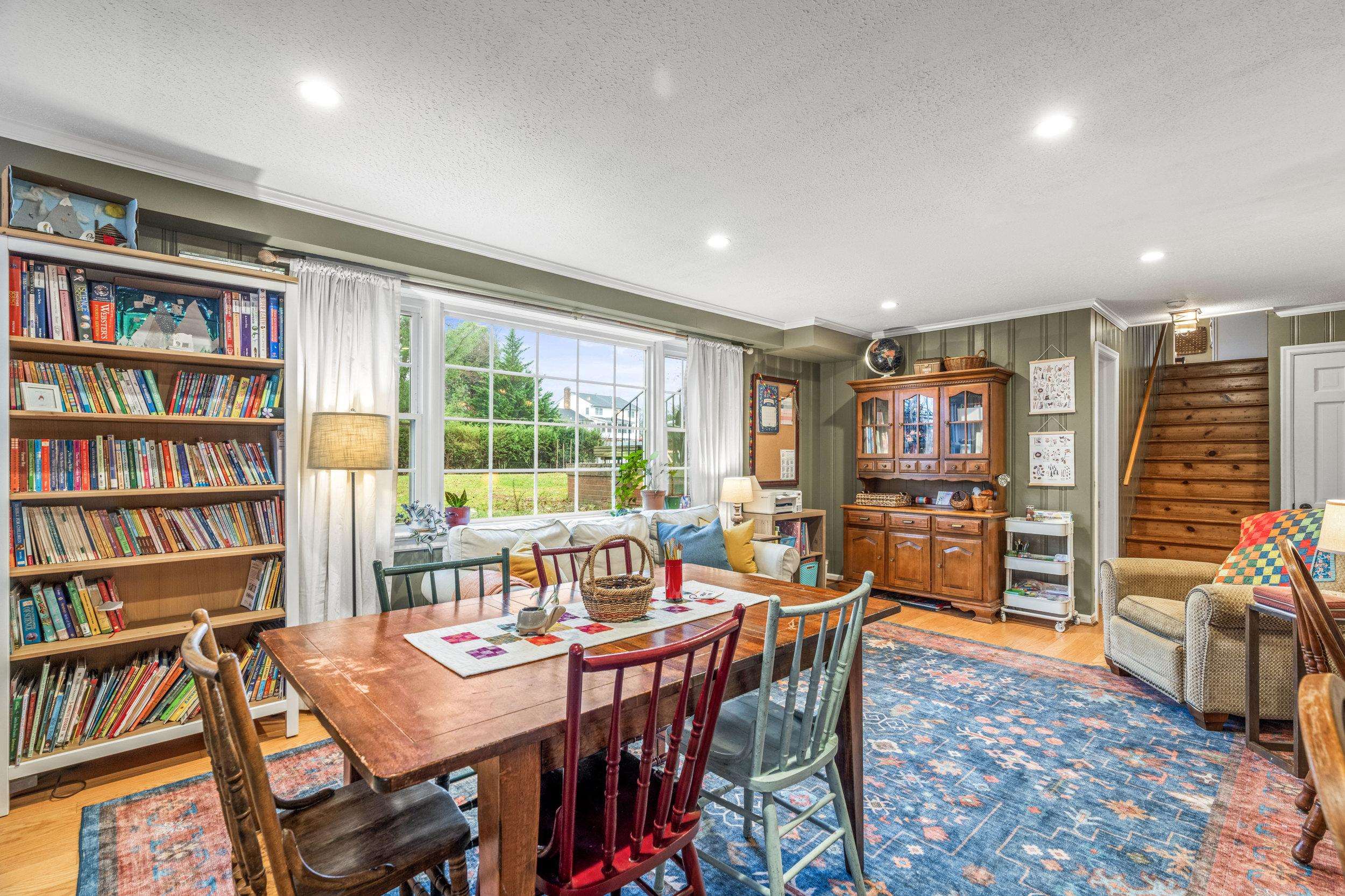 1220 Chatham Road Waynesboro, VA 22980 - Photo 33 of 64 a view of a dining room with furniture and a book shelf