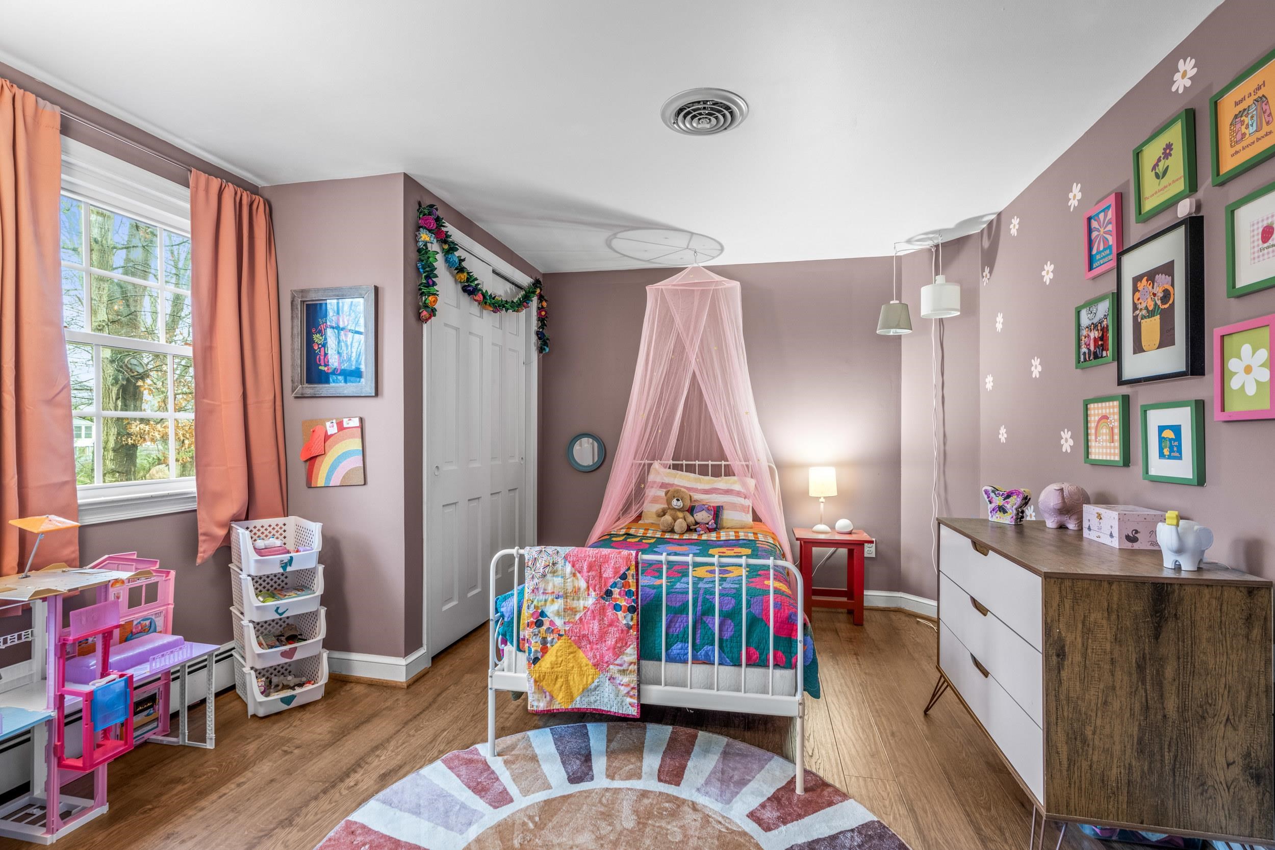 1220 Chatham Road Waynesboro, VA 22980 - Photo 50 of 64 a living room with furniture a baby crib and a wooden floor