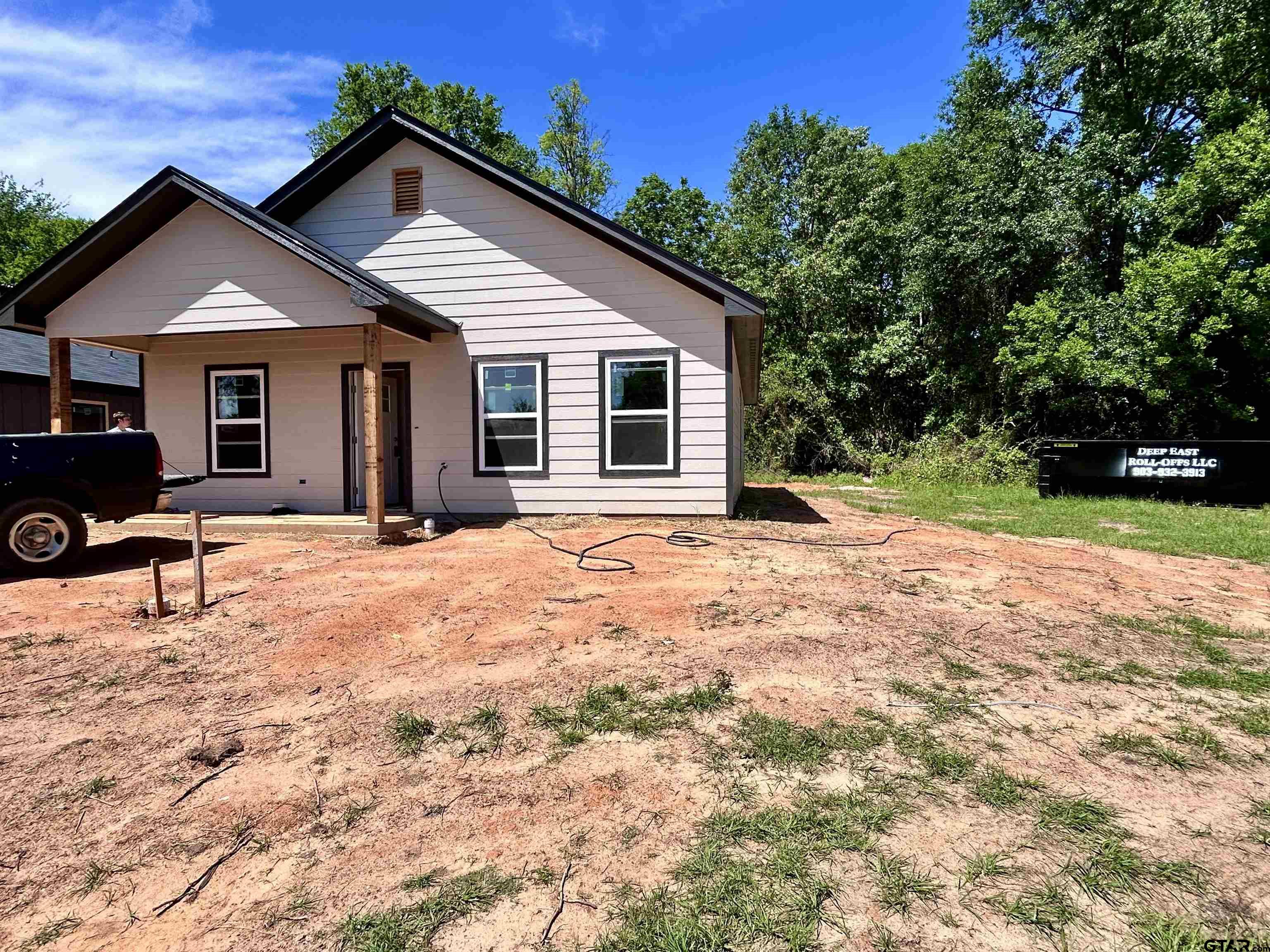 203 East Fleming Street Longview, TX 75604 - Photo 1 of 12 a view of a house with a yard