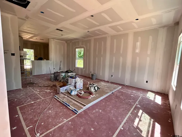 a living room with hard wood floor and furniture