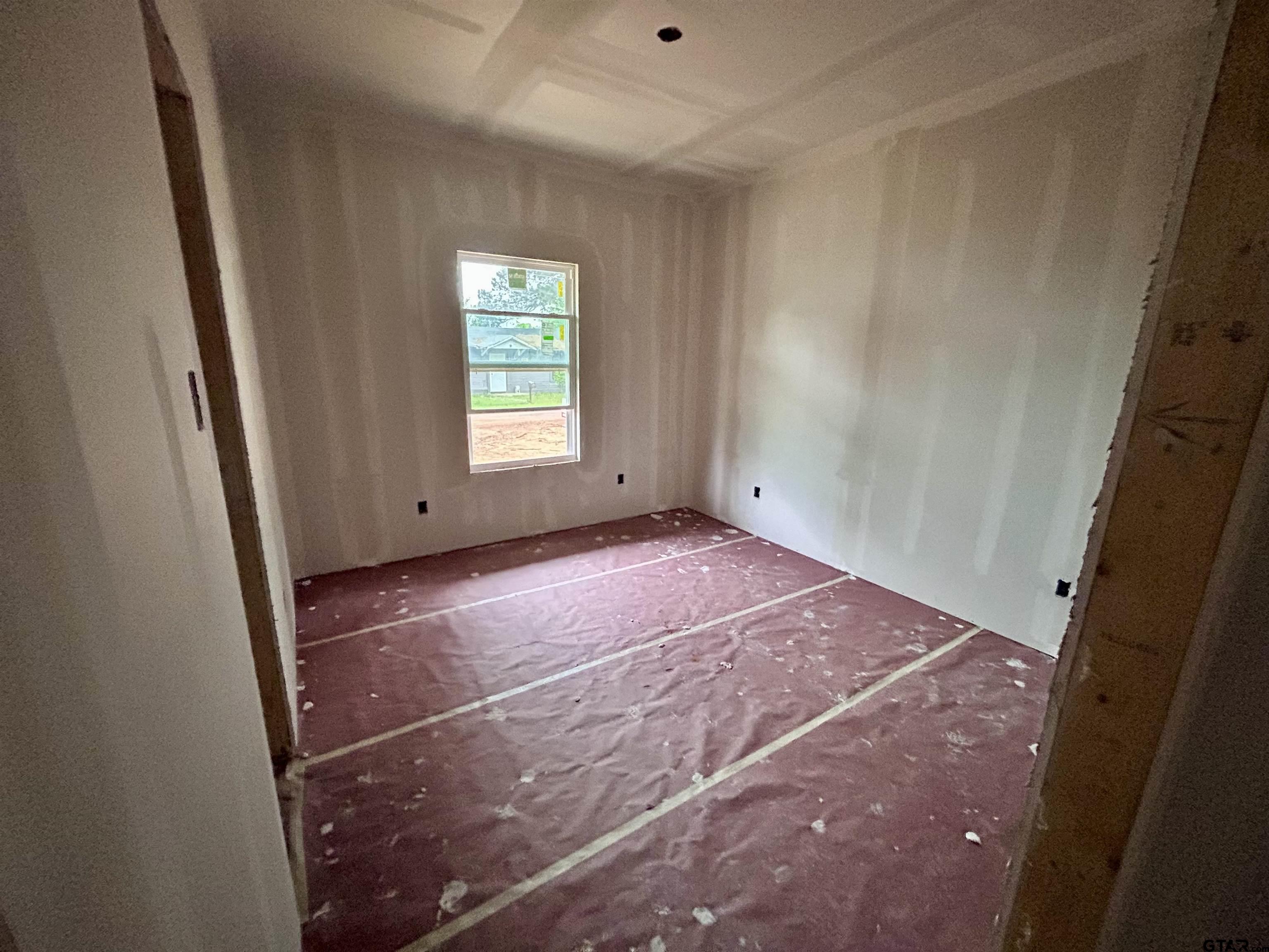 203 East Fleming Street Longview, TX 75604 - Photo 7 of 12 a view of empty room with window