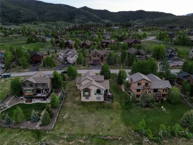 an aerial view of a house with mountain view