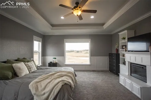 a bedroom with a bed and a fireplace