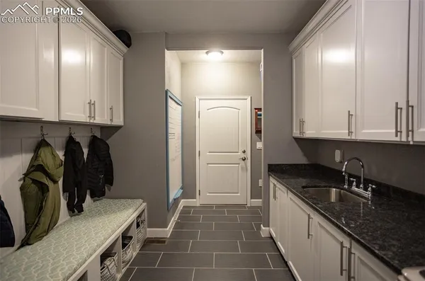a kitchen that has a sink and a stove