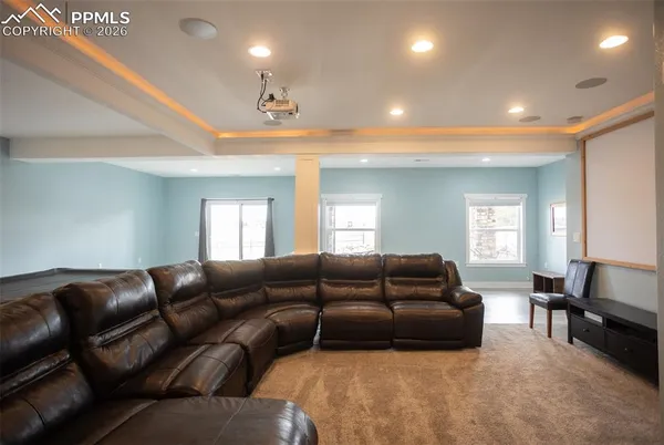 a living room with furniture window and a couch