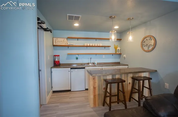 a kitchen with a table and cabinets