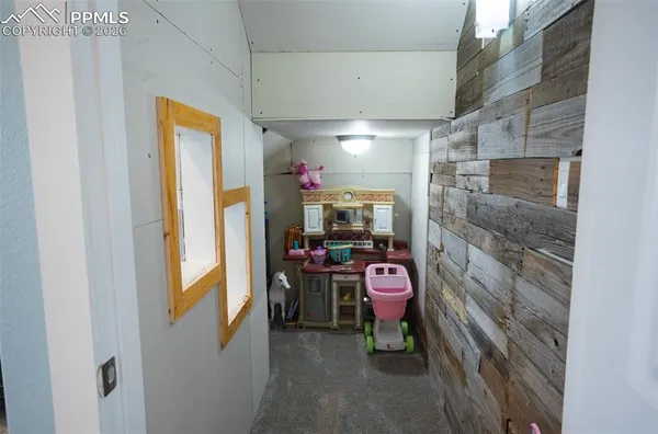 a view of a room with storage and utility room