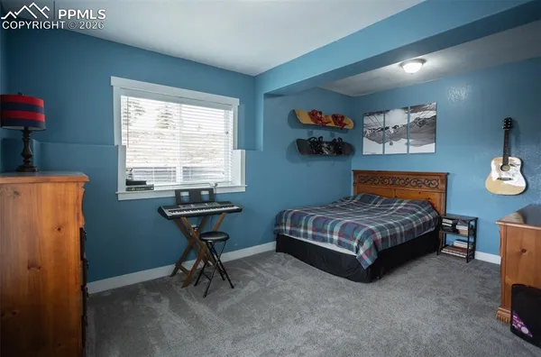a bedroom with a bed and a table in it