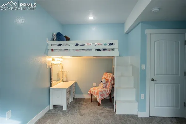 a bed room with a bed and a window
