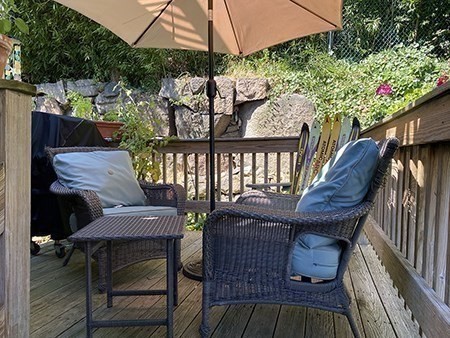 274 Main Street, Unit 5 Gloucester, MA 01930 - Photo 17 of 17 a view of a wooden chairs in patio of a house