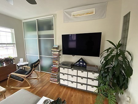 274 Main Street, Unit 5 Gloucester, MA 01930 - Photo 9 of 17 a living room with furniture and a flat screen tv