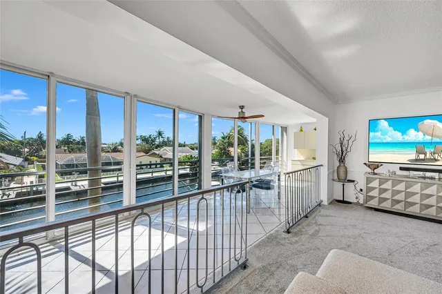 a view of a living room and a large window