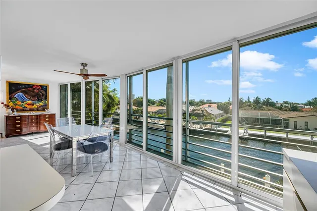 a living room with furniture and view of kitchen