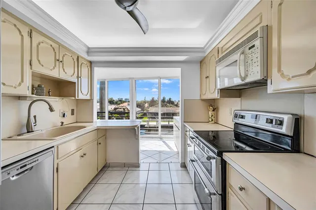 a kitchen with stainless steel appliances granite countertop a stove and a refrigerator