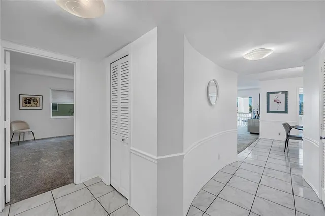 a living room with a bed furniture and a window
