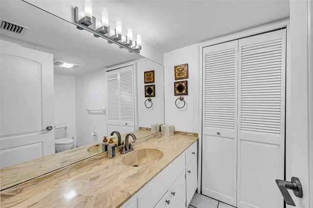 a bathroom with a shower and mirror