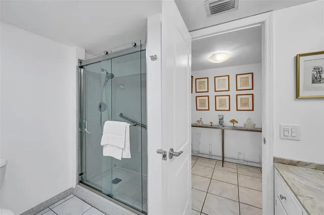 a utility room with dryer washer and a wooden floor