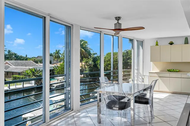 a dining room with furniture a chandelier and fireplace
