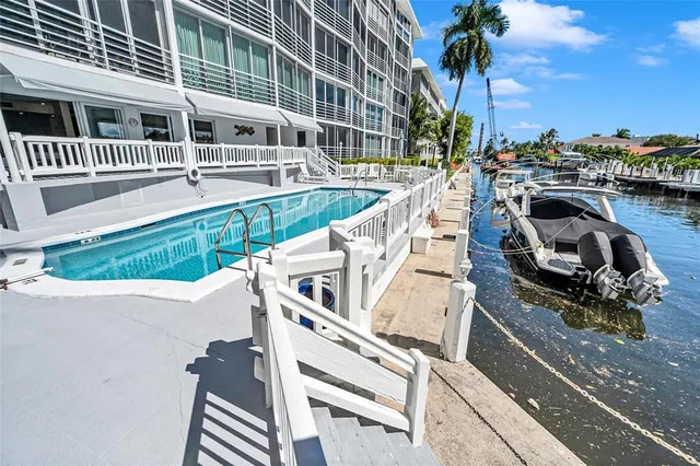 a view of a chair and tables in the balcony