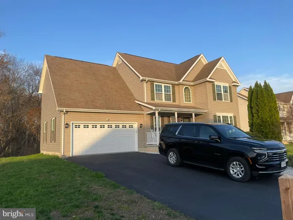 a car parked in front of a house