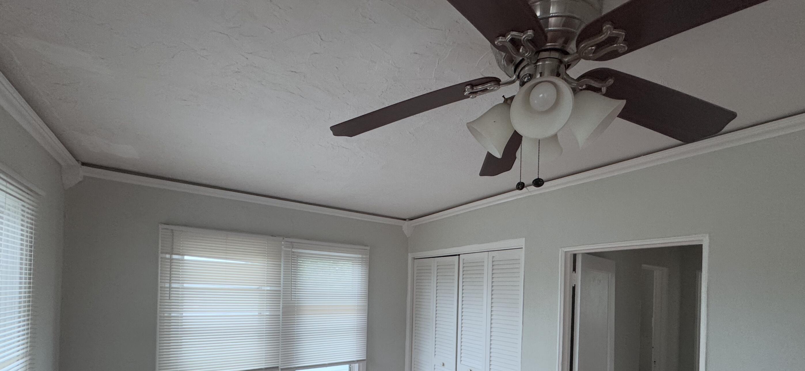 736 Omar Road, Unit 4 West Palm Beach, FL 33405 - Photo 13 of 17 a view of room with a ceiling fan