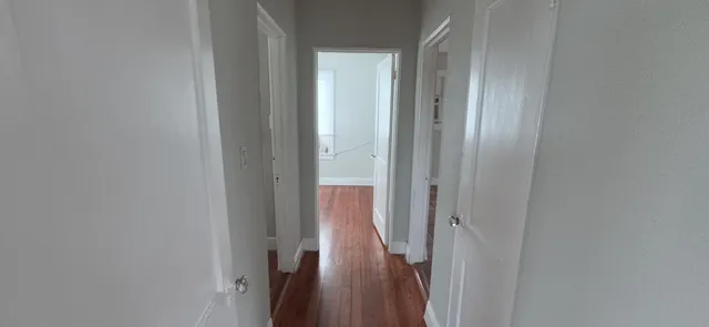 a view of a hallway with a glass door