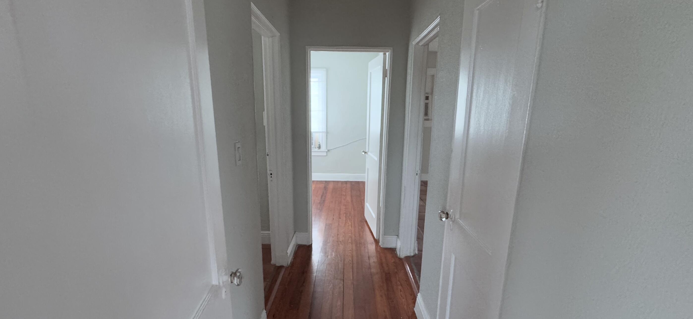 736 Omar Road, Unit 4 West Palm Beach, FL 33405 - Photo 14 of 17 a view of a hallway with a glass door