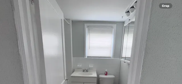 a bathroom with a sink and a window