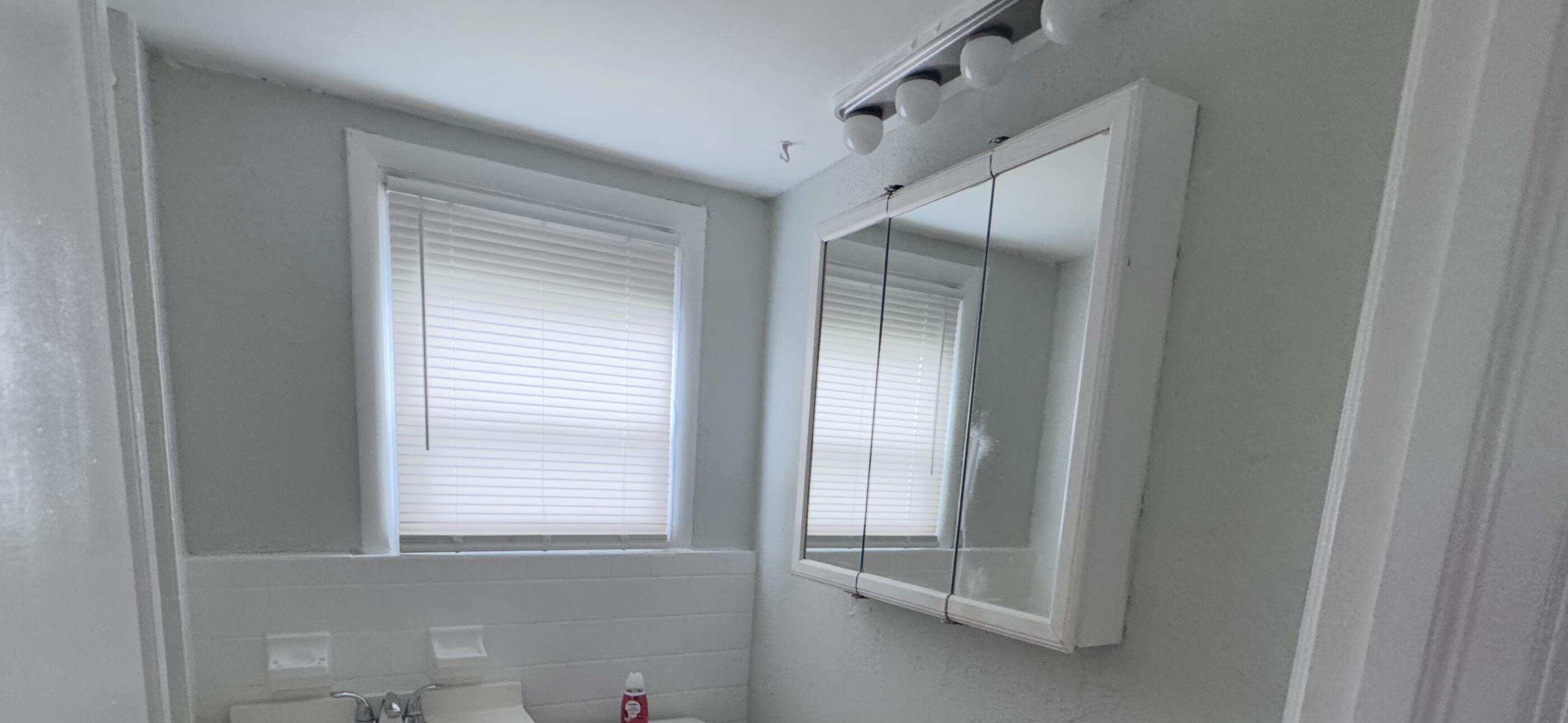 736 Omar Road, Unit 4 West Palm Beach, FL 33405 - Photo 16 of 17 a view of an empty room with a window